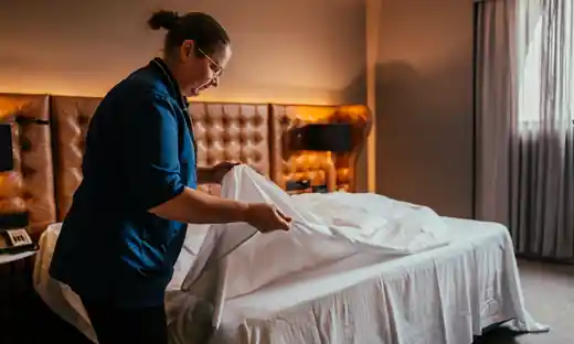 Fresh linens on a neatly made bed