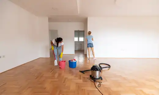 Cleaners preparing an empty room